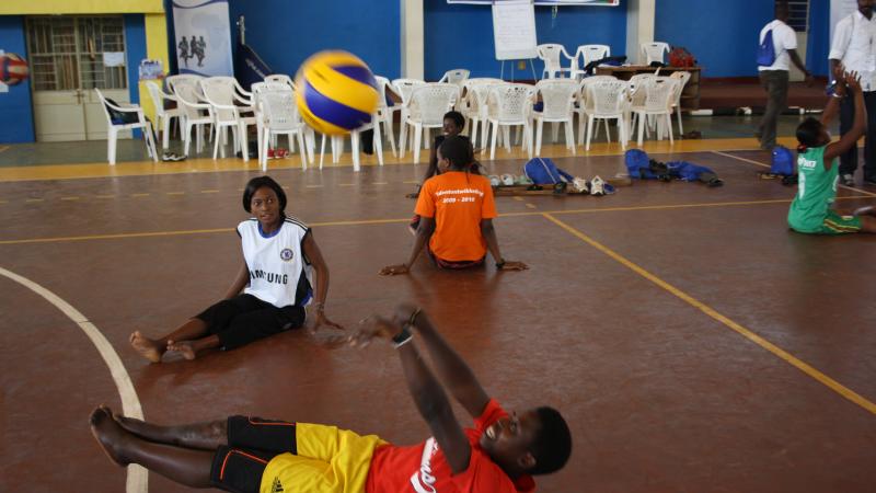 Athletes and coaches received training for sitting volleyball Athlete hitting a volleyball