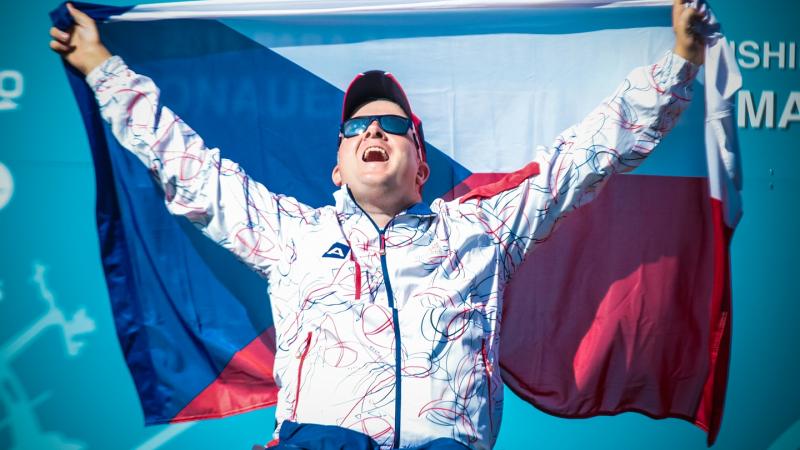David Drahoninsky - Archery Archer raises flag